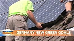 Solar panels being assembled on rooftop.