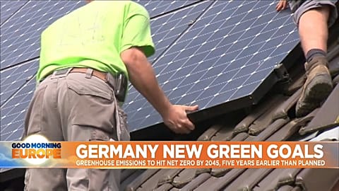 Solar panels being assembled on rooftop.