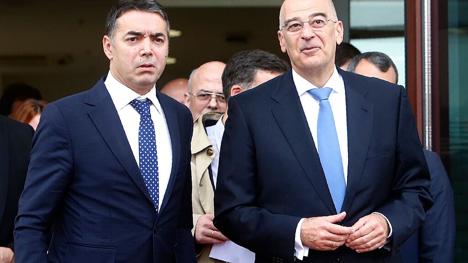 Greek Foreign Minister Nikos Dendias, right and his North Macedonia's counterpart Nikola Dimitrov