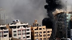 A view of a 11-story building housing AP office and other media in Gaza City is seen moments after Israeli warplanes demolished it, Saturday, May 15, 2021. 