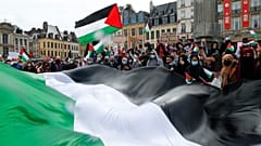 People hold Palestinian flags during a demonstration in Lille, northern France, Saturday May 15, 2021. 