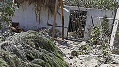 Debris from an Israeli airstrike scatters the family farm of Associated Press journalist Fares Akram on Friday, May 14, 2021, in the northern Gaza Strip.