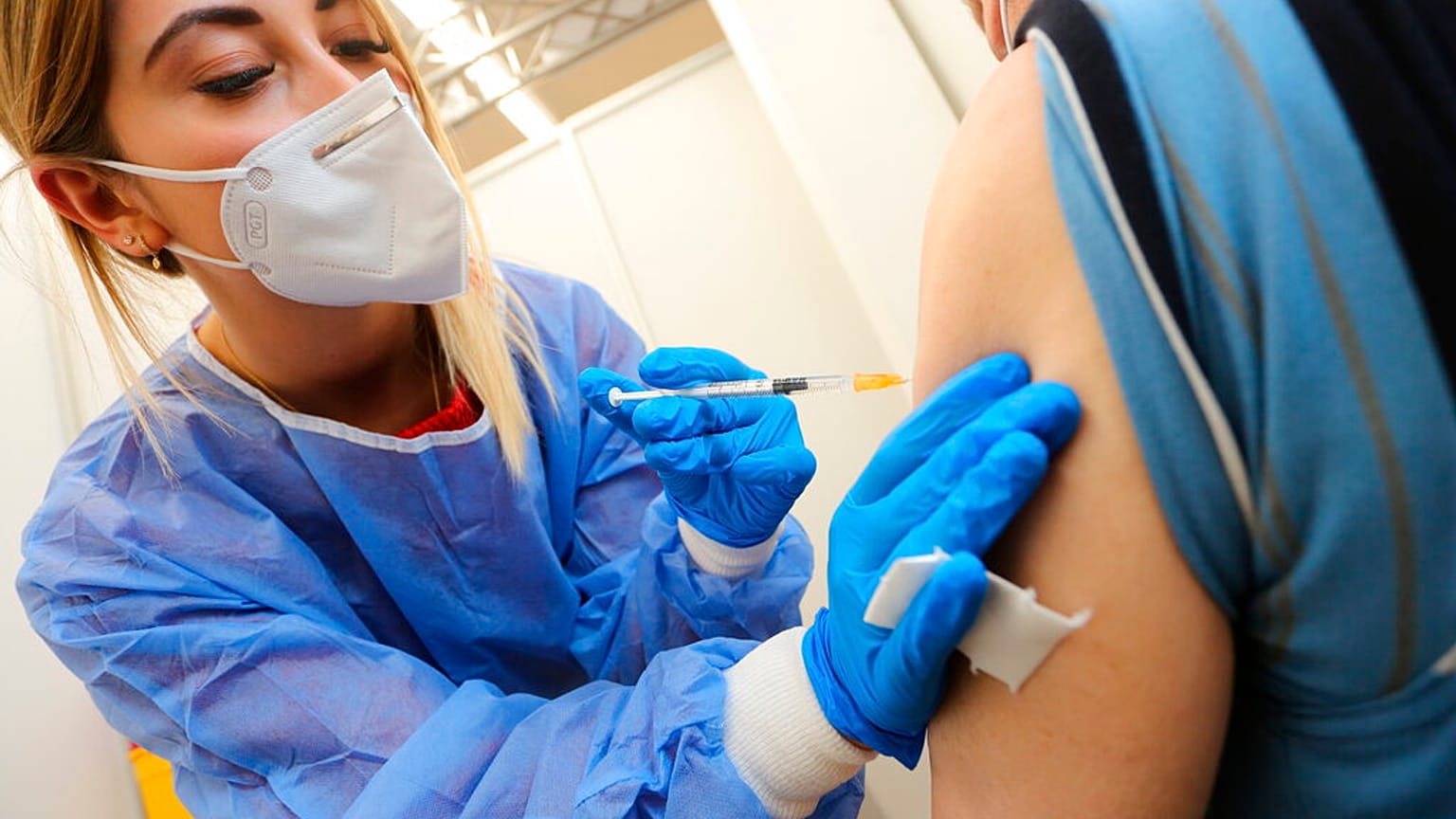 Nurse Jasmin Lasse gives a patient the jab in the vaccination centre in Quedlinburg, Germany, on Thursday