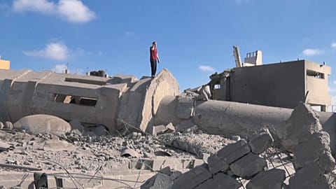 A man praying amid the rubble of the Qlebo mosque at the Jabalia refugee camp in the northern Gaza Strip.