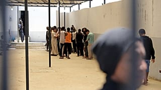 People gathered inside a Tripoli detention centre, pictured in May 2017