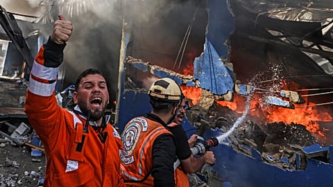 Palestinian firemen try to extinguish huge fire at mattress factory east of Jabalia