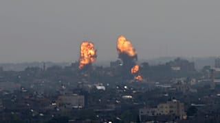 Flares rise after an Israeli forces strike in Gaza City