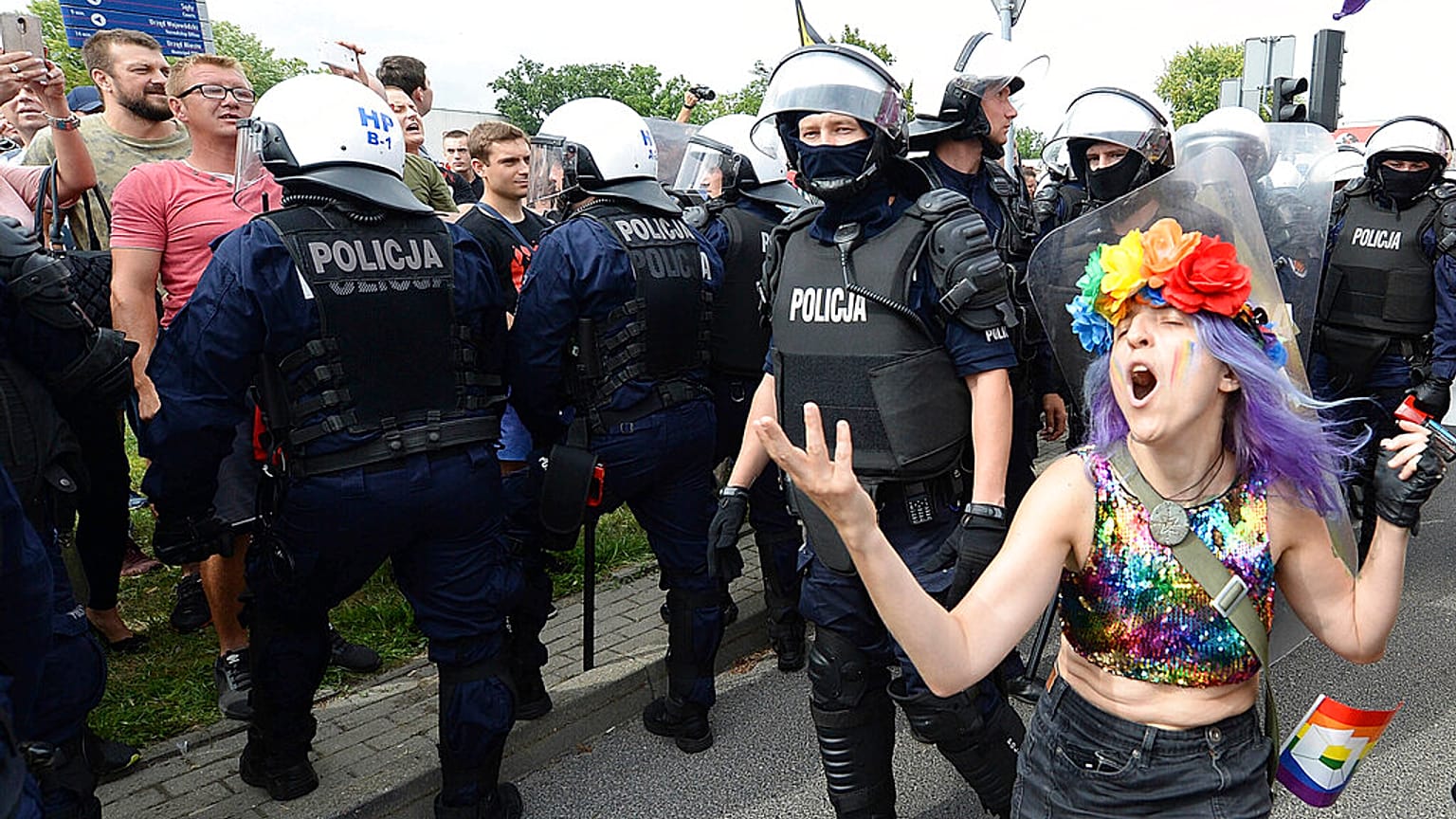 LGBT activists and their supporters gather for the first-ever pride parade in the central city of Plock, Poland, on Saturday Aug. 10, 2019.