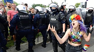 LGBT activists and their supporters gather for the first-ever pride parade in the central city of Plock, Poland, on Saturday Aug. 10, 2019.