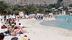 A view of the beach of Mondello, Sicily, crowded with sunbathers after the slowdown of the diffusion of Covid-19 virus allowed the reopening of beaches in Sicily. 