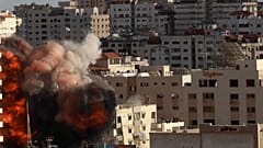 An Israeli air strike hits a building in Gaza City, Monday, May 17, 2021. 