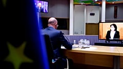 European Council President Charles Michel, left, speaks with Georgian President Salome Zurabishvili, on screen, during a video conference at the European Council on April 19