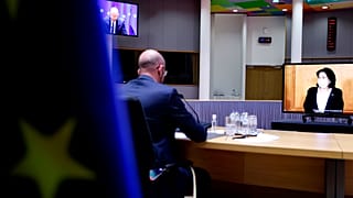 European Council President Charles Michel, left, speaks with Georgian President Salome Zurabishvili, on screen, during a video conference at the European Council on April 19