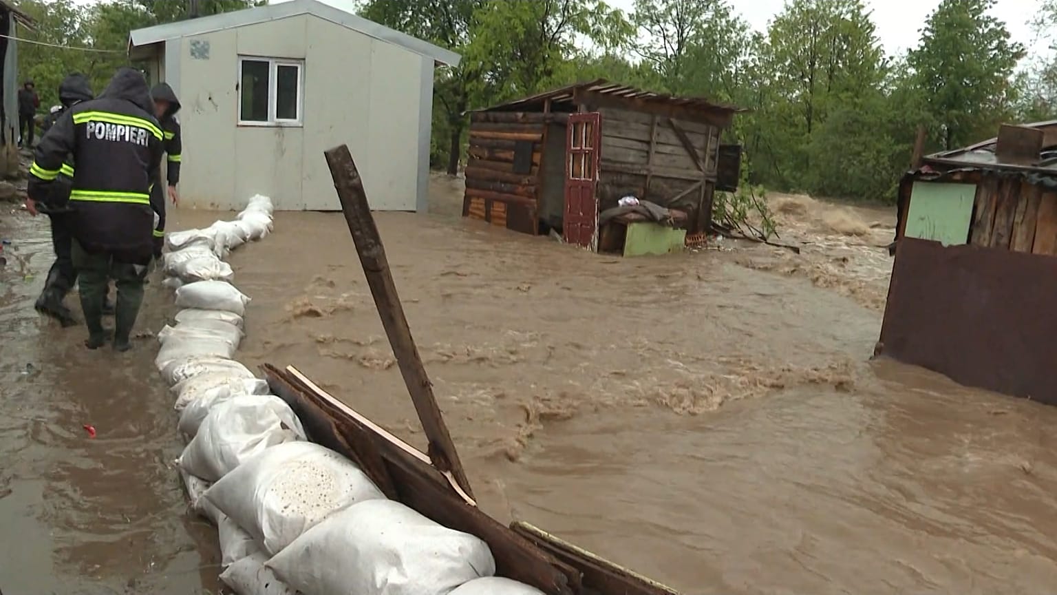 Rescue teams building sand sacks dam