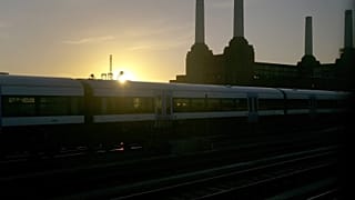 A train makes it's way towards Victoria railway station in central London, Thursday, Jan. 2, 2014