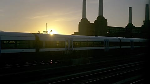 A train makes it's way towards Victoria railway station in central London, Thursday, Jan. 2, 2014