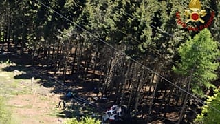 The wreckage of a cable car is seen on the ground after it collapsed near the summit of the Stresa-Mottarone line in the Piedmont region, northern Italy, May 23, 2022.
