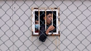 Children who crossed into Spain wait inside a temporary shelter in the enclave of Ceuta, next to the border of Morocco and Spain, Thursday, May 20, 2021.