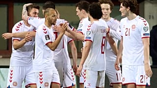Denmark players celebrate a goal against Austria during their 2022 FIFA World Cup qualifying match.