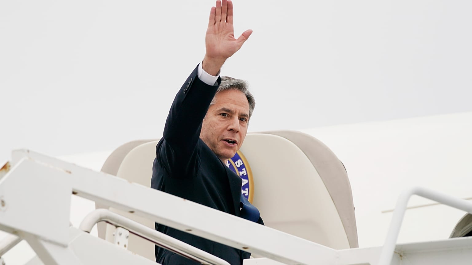 Secretary of State Antony Blinken waves as he departs, Monday, May 24, 2021, at Andrews Air Force Base, Md.