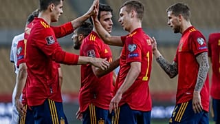 Spain players celebrate after scoring the opening goal during their 2022 FIFA World Cup qualifying match against Kosovo.