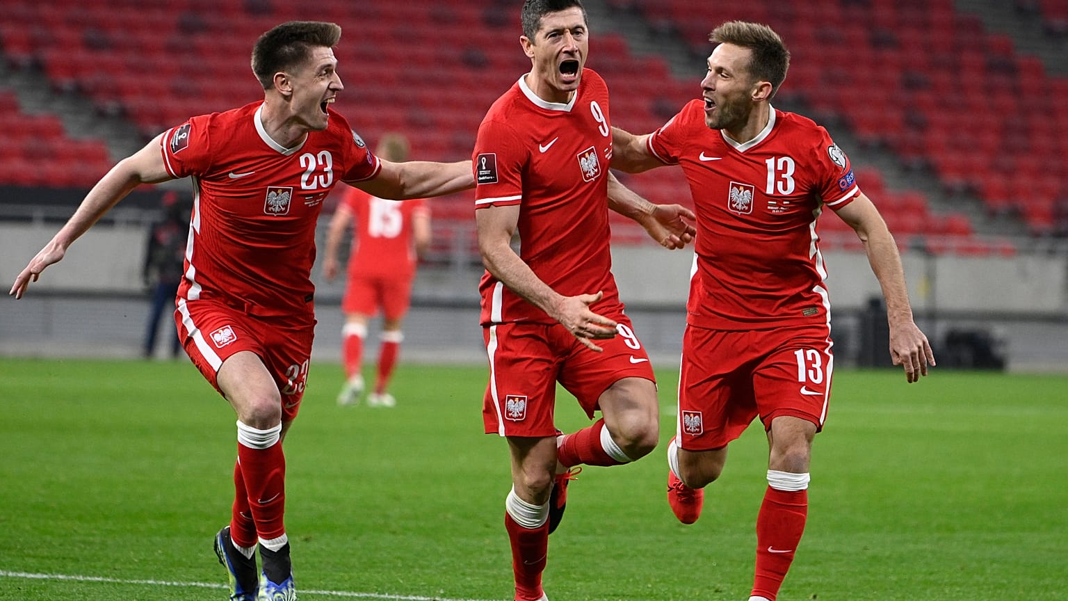 Robert Lewandowski celebrates after scoring Poland's third goal against Hungary during the 2022 FIFA World Cup qualifying match.