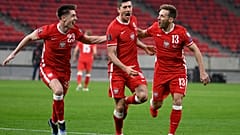 Robert Lewandowski celebrates after scoring Poland's third goal against Hungary during the 2022 FIFA World Cup qualifying match.