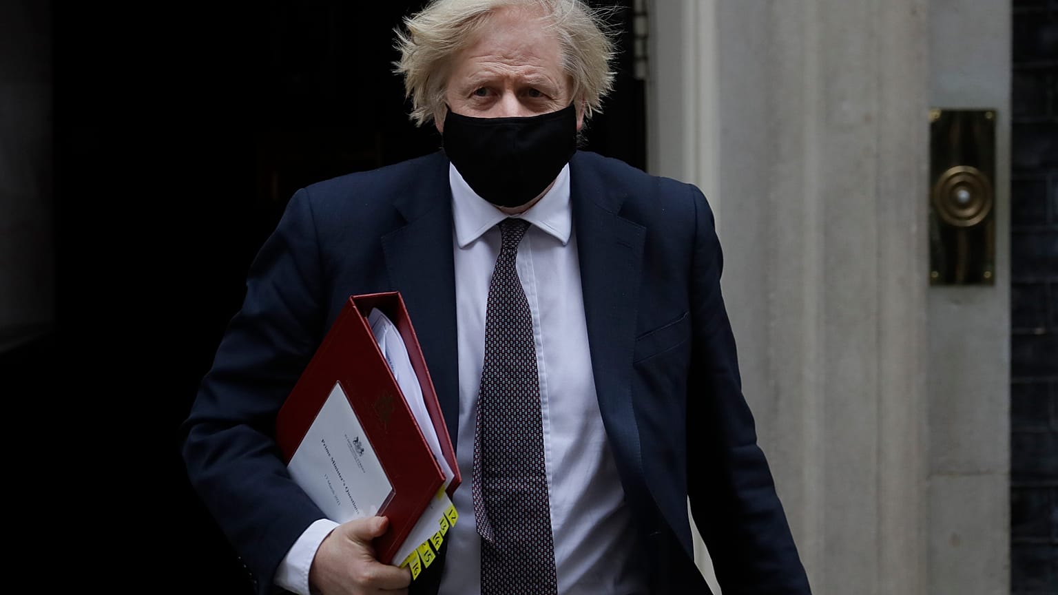 Britain's Prime Minister Boris Johnson leaves Downing Street to attend the weekly session of PMQs in Parliament in London, Wednesday, March 17, 2021.