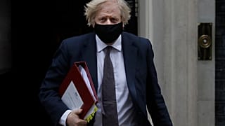 Britain's Prime Minister Boris Johnson leaves Downing Street to attend the weekly session of PMQs in Parliament in London, Wednesday, March 17, 2021.
