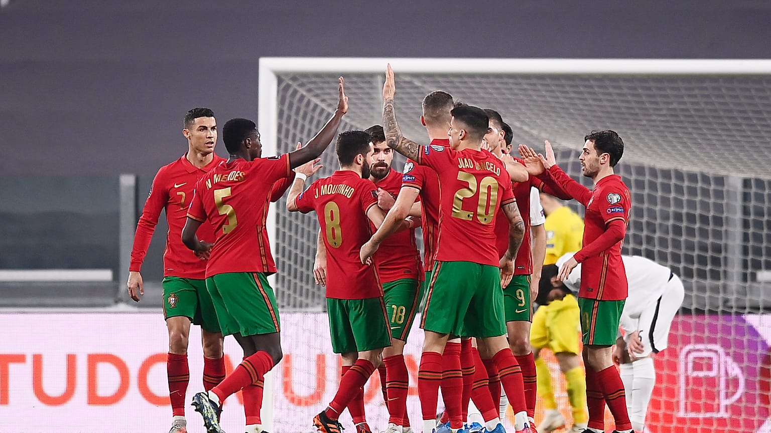 Portugal's players celebrate during their 2022 FIFA World Cup qualifying match against Azerbaijan.
