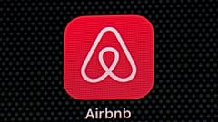 The Airbnb app icon is seen on an iPad screen