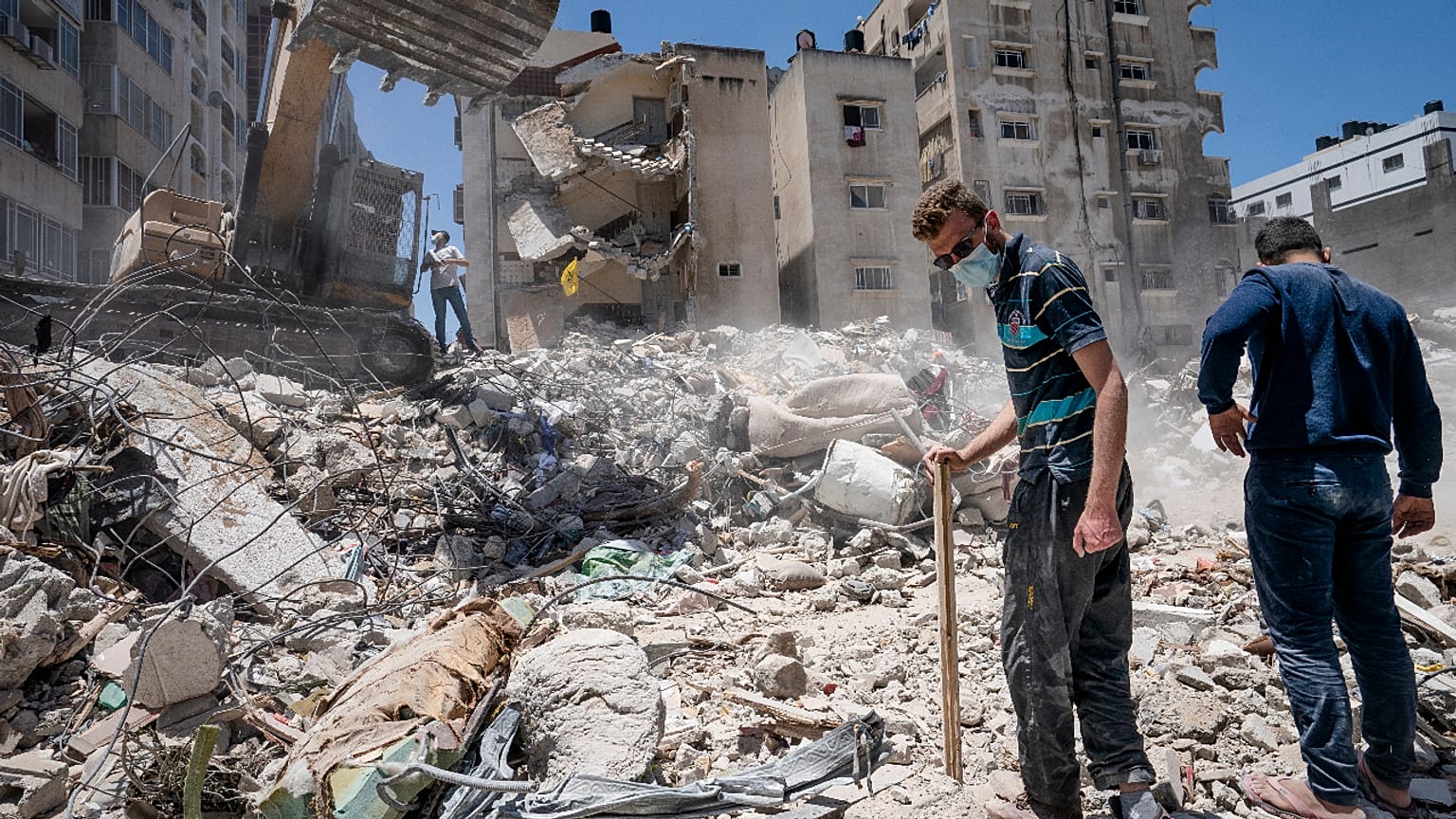 Heavy construction equipment is used to sift through rubble in Gaza City on Thursday, May 27, 2021.