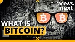 A person holds a visual representation of the digital cryptocurrency Bitcoin, at the "Bitcoin Change" shop in the Israeli city of Tel Aviv.