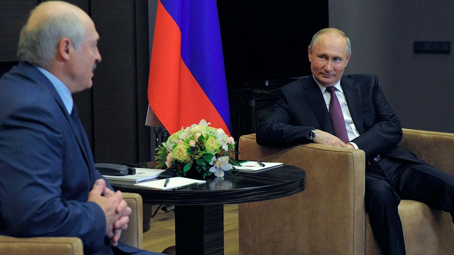 Russian President Vladimir Putin, right, listens to Belarusian President Alexander Lukashenko during a meeting in the Black Sea resort of Sochi, Russia, Friday, May 28, 2021.
