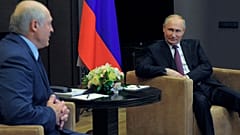 Russian President Vladimir Putin, right, listens to Belarusian President Alexander Lukashenko during a meeting in the Black Sea resort of Sochi, Russia, Friday, May 28, 2021.