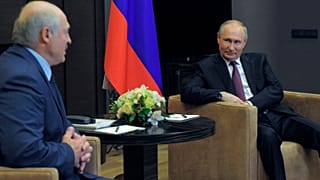 Russian President Vladimir Putin, right, listens to Belarusian President Alexander Lukashenko during a meeting in the Black Sea resort of Sochi, Russia, Friday, May 28, 2021.