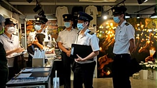 Police question staff at the June 4 Memorial Museum in Hong Kong