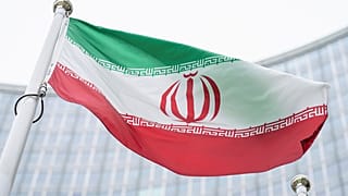 Iran's flag waves outside the International Atomic Energy Agency HQ in Vienna