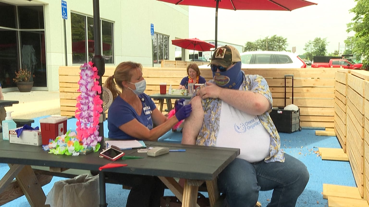 Man getting a Johnson & Johnson vaccine shot at Beltway Brewing.