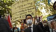 Hong Kong activist Nathan Law, centre, taking part in an anti-Beijing protest in Berlin, Germany.