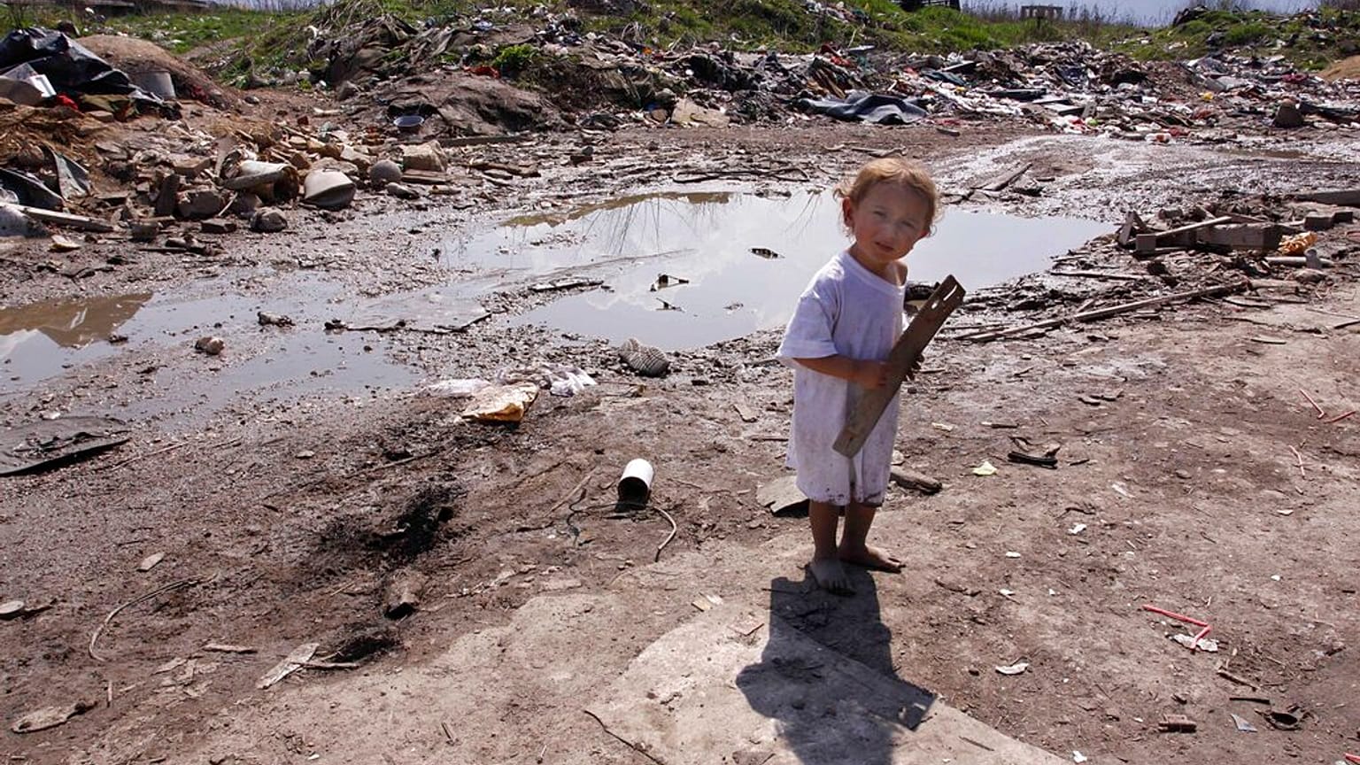 A Roma girl, seen at a settlement, in the Sarajevo suburb of Butmir, Wednesday, April 8, 2009