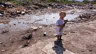 A Roma girl, seen at a settlement, in the Sarajevo suburb of Butmir, Wednesday, April 8, 2009