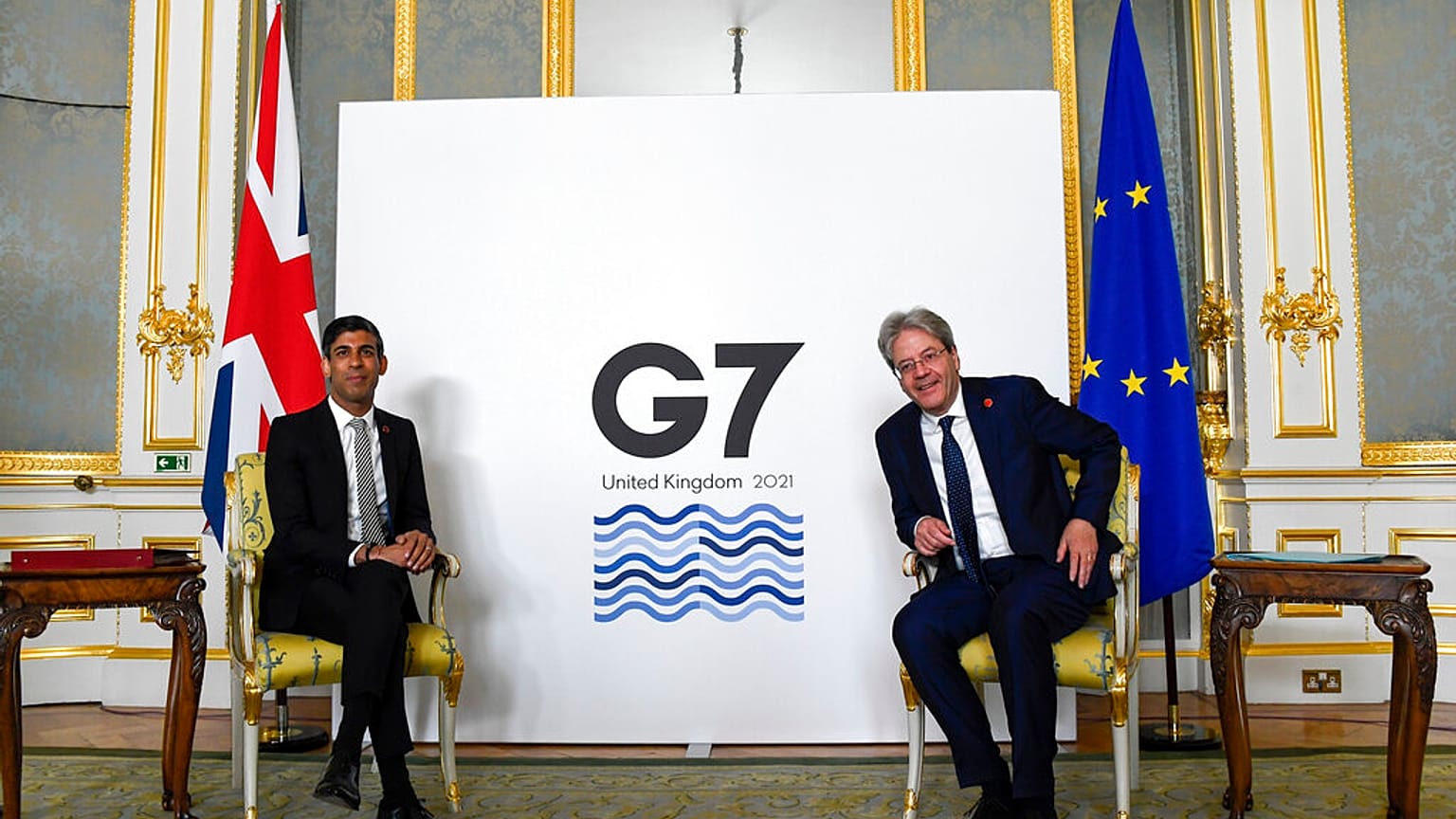 Britain's Chancellor of the Exchequer Rishi Sunak, left, and EU's Economy Commissioner Paolo Gentiloni pose for photos at the G7 summit