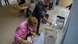 People cast their vote at a polling station, in Mexico City, on June 6, 2021