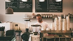 Staff making coffee at a cafe 