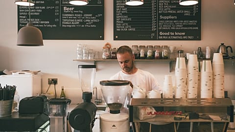 Staff making coffee at a cafe 