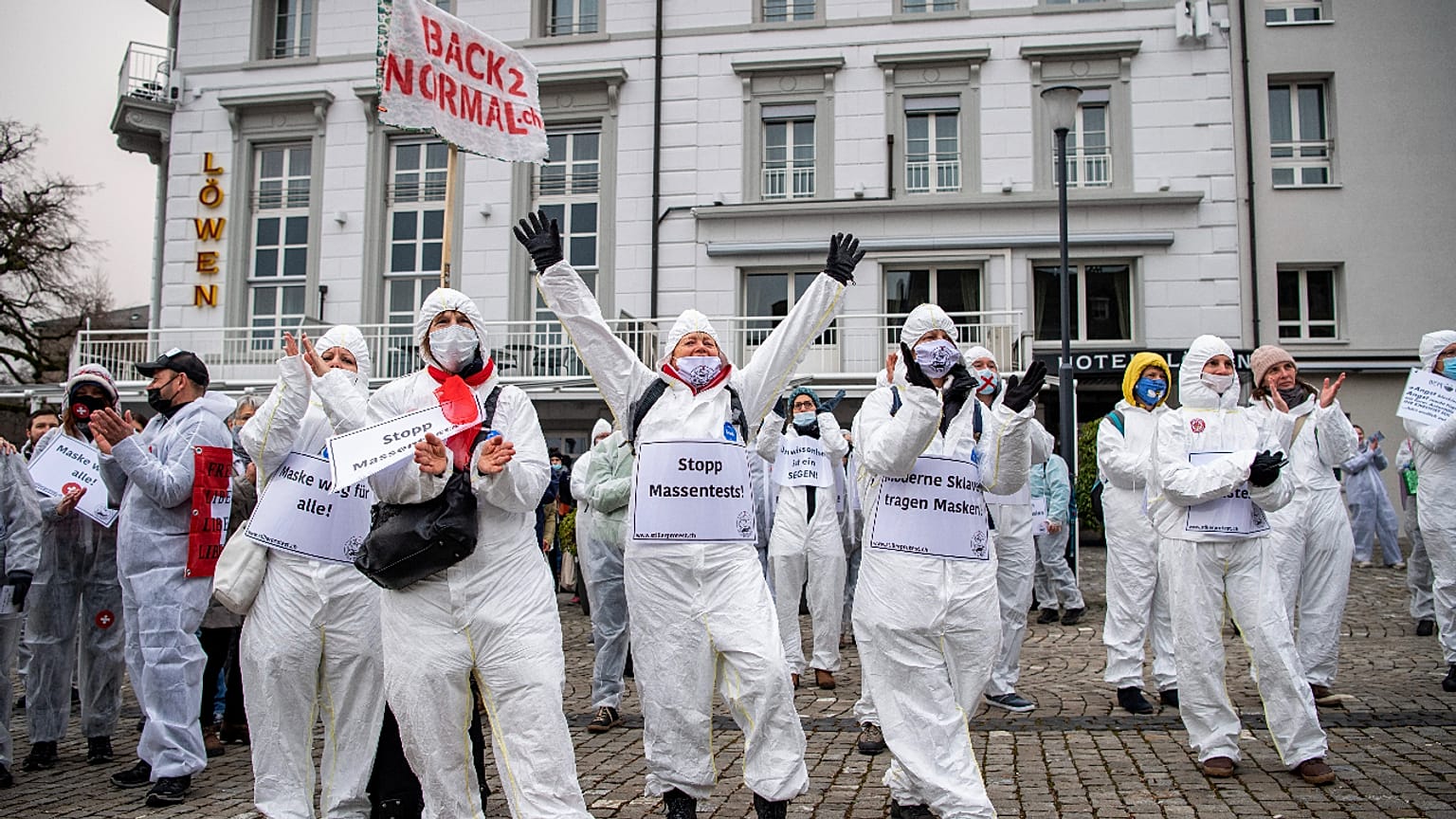 Demonstrators in Zug, Switzerland, protest against the COVID-19 measures enforced by the government on Saturday, February 6, 2021.