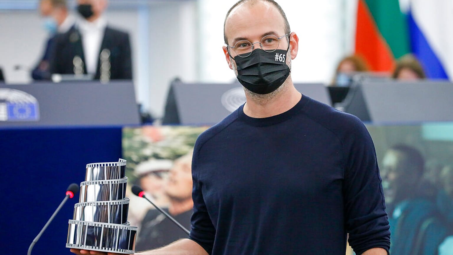 Romanian director Alexander Nanau holds the Lux Audience Award at the European Parliament in Strasbourg, Wednesday, June 9, 2021.