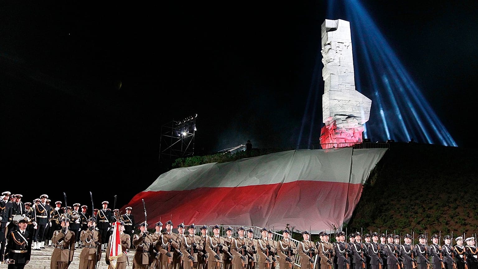Polish Navy troops standing at monument to Polish defenders of the Westerplatte peninsula, where some of World War II's first shots were fired. FILE