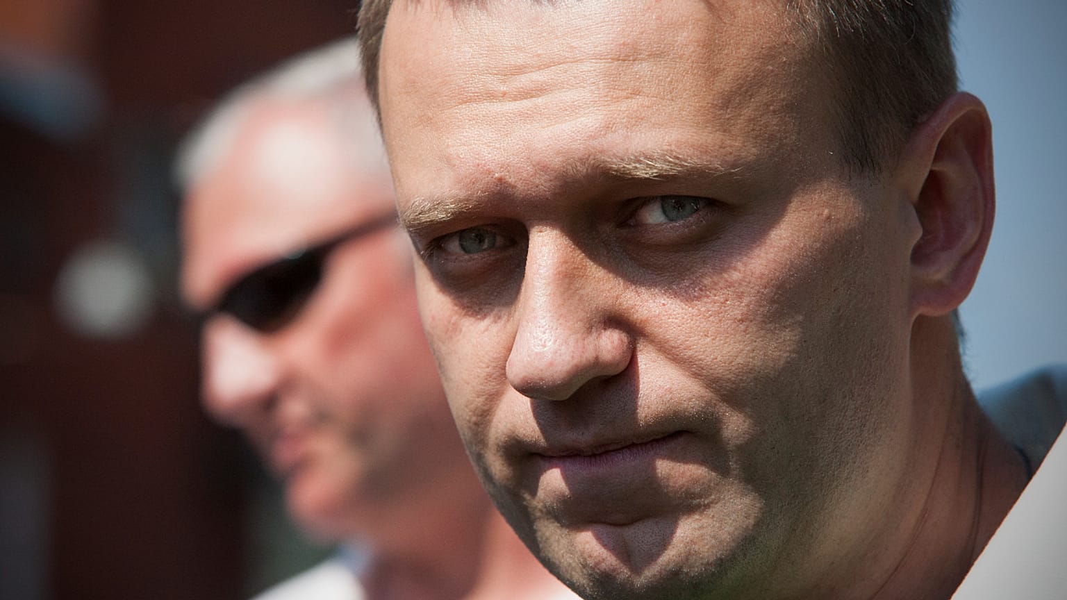 Russian protest leader Alexei Navalny leaves the headquarters of the Russian Investigation committee in Moscow, Russia, Friday, Aug. 3, 2012.